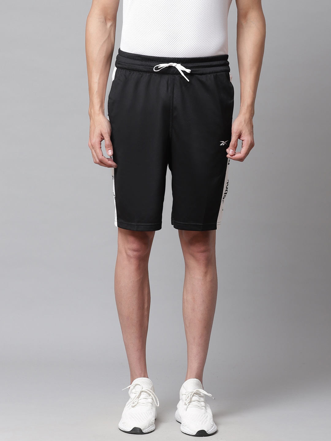 

Reebok Men Black Solid Training Essential Linear Logo Slim Fit Shorts