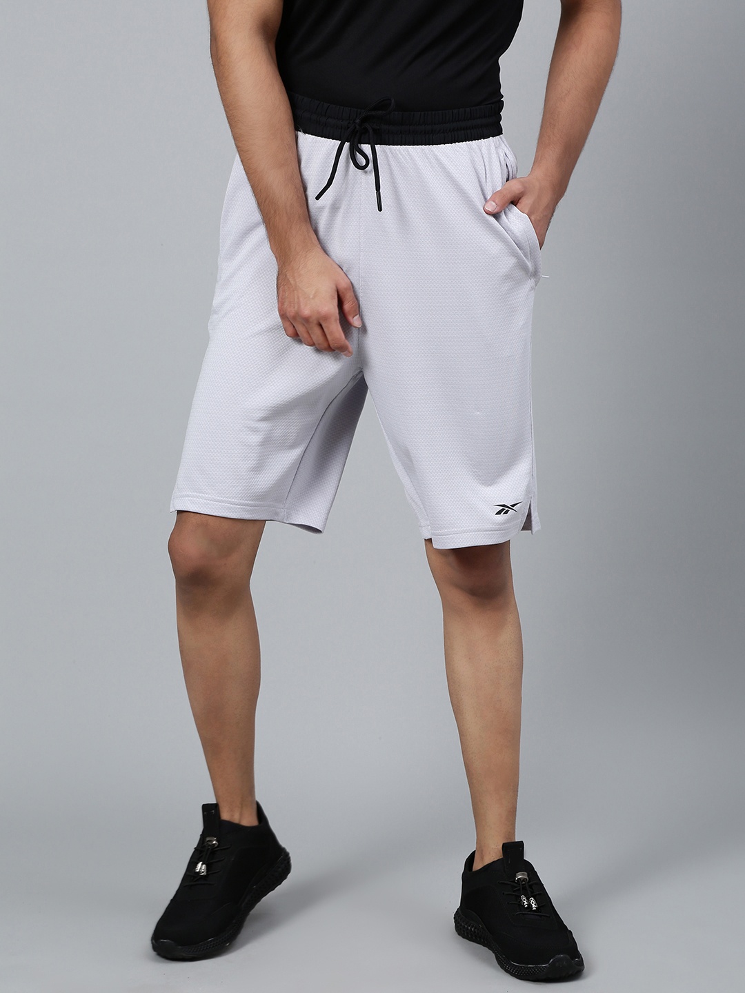 

Reebok Men Grey Self Design Training Wor Knit Performance Shorts