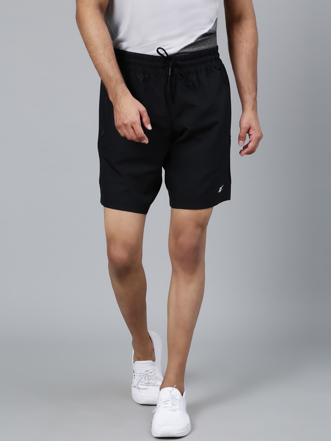 

Reebok Men Black Solid Training Wor Woven Shorts