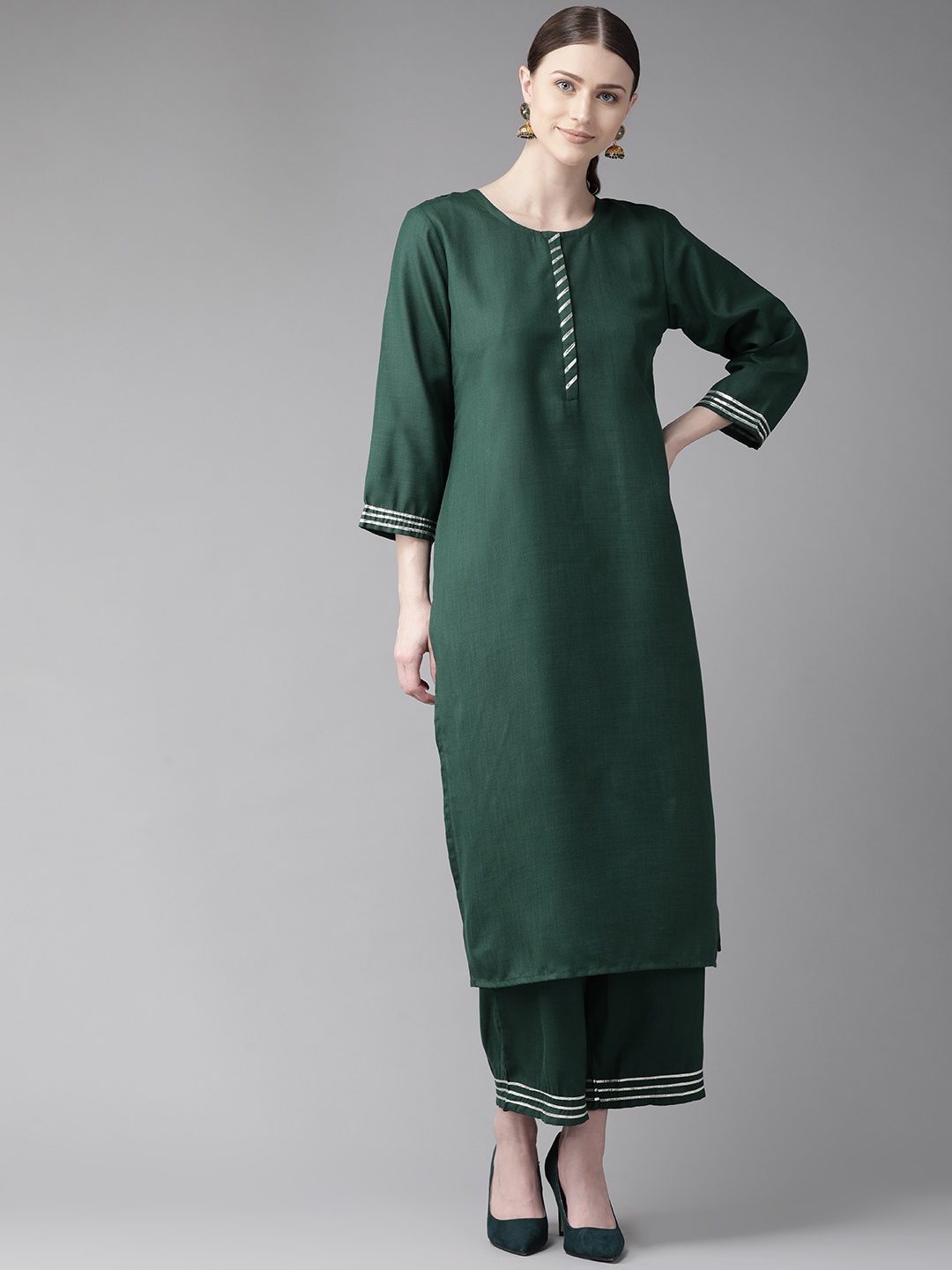 

Bhama Couture Women Green Solid Kurta with Palazzos