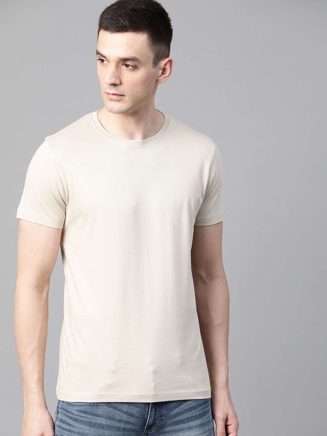 

Roadster Men Beige Solid Round Neck T-shirt