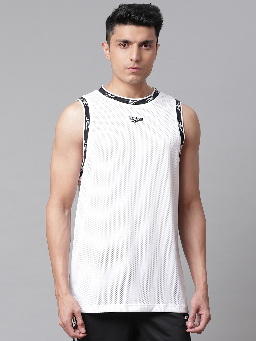 

Reebok Classic Men White Solid Ball Jersey Relaxed Fit T-shirt