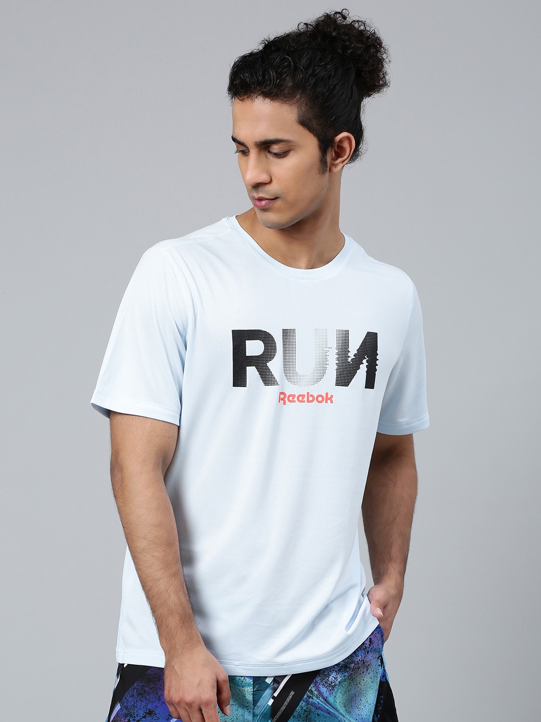 

Reebok Men Blue Printed Running Essentials Graphic T-Shirt