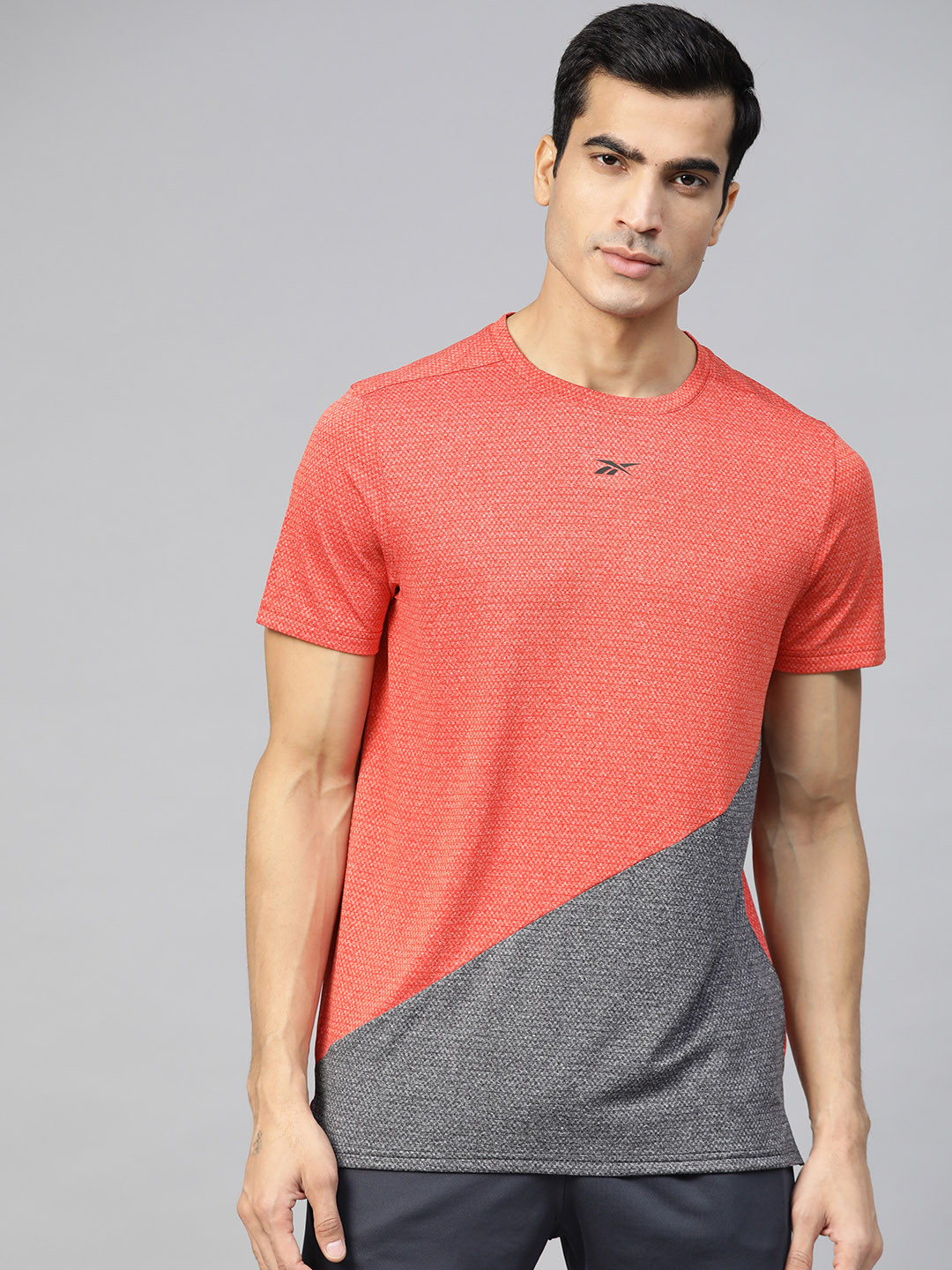 

Reebok Men Coral Orange and Grey Wor Melange Colorblocked Training T-shirt