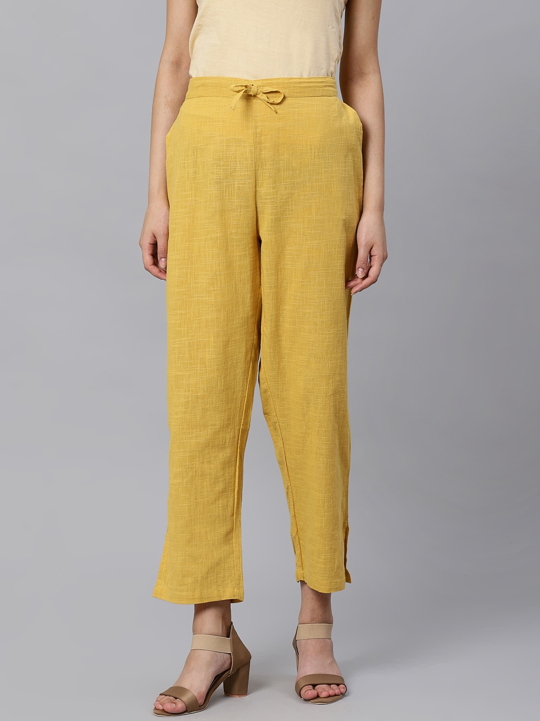 

Kifahari Women Mustard Yellow Straight Fit Solid Cropped Regular Trousers
