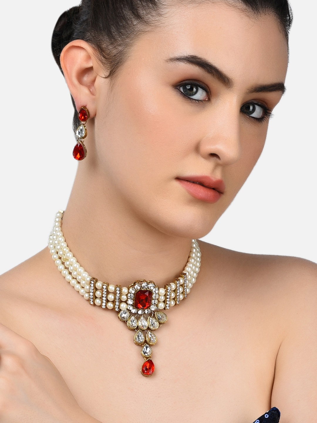 

Zaveri Pearls Gold-Plated White & Red Crystal Stone & Pearls Embellished Jewellery Set