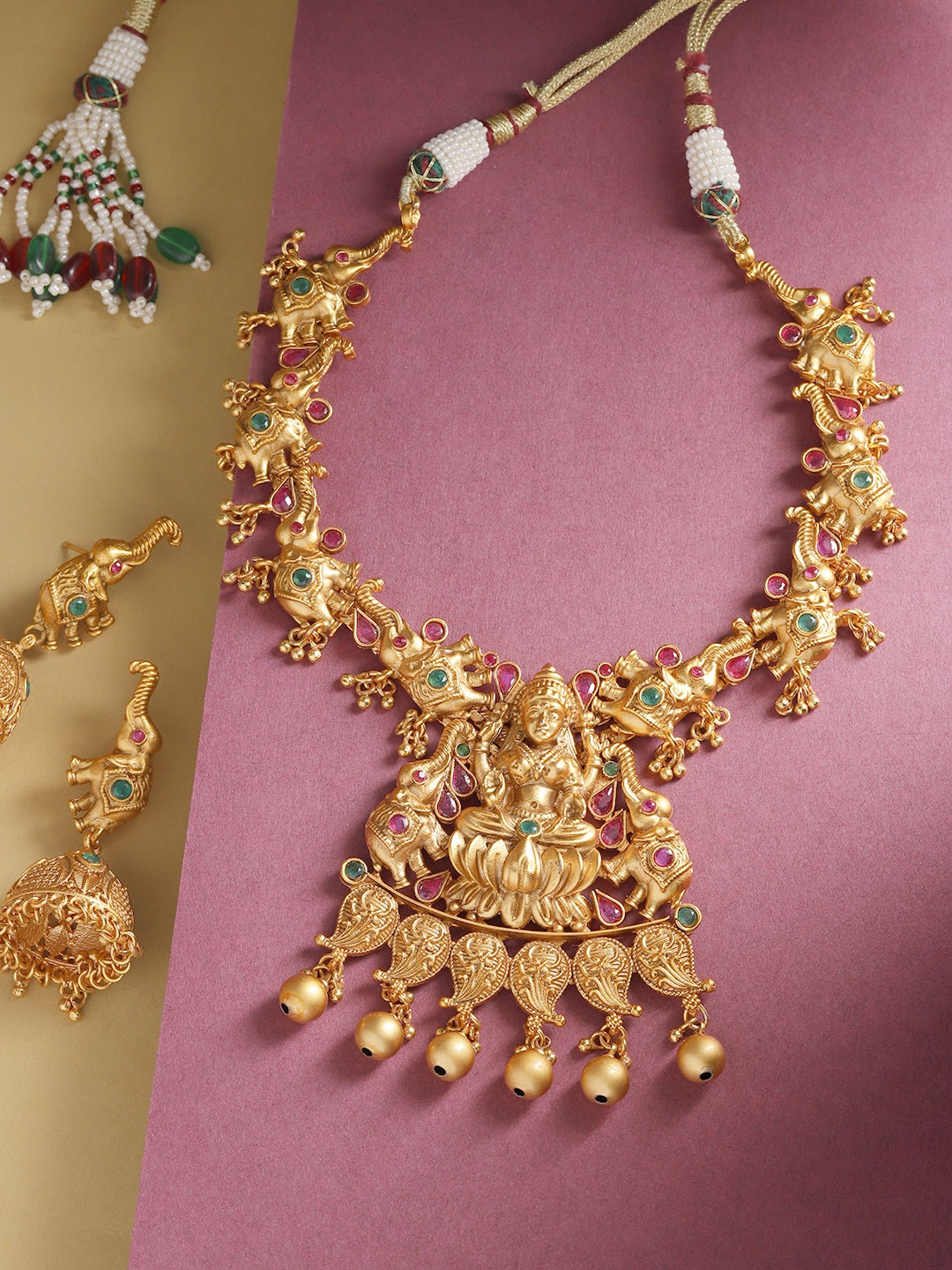 

Priyaasi Magenta Antique Gold-Plated Stone Studded & Beaded Goddess Laxmi Jewellery Set