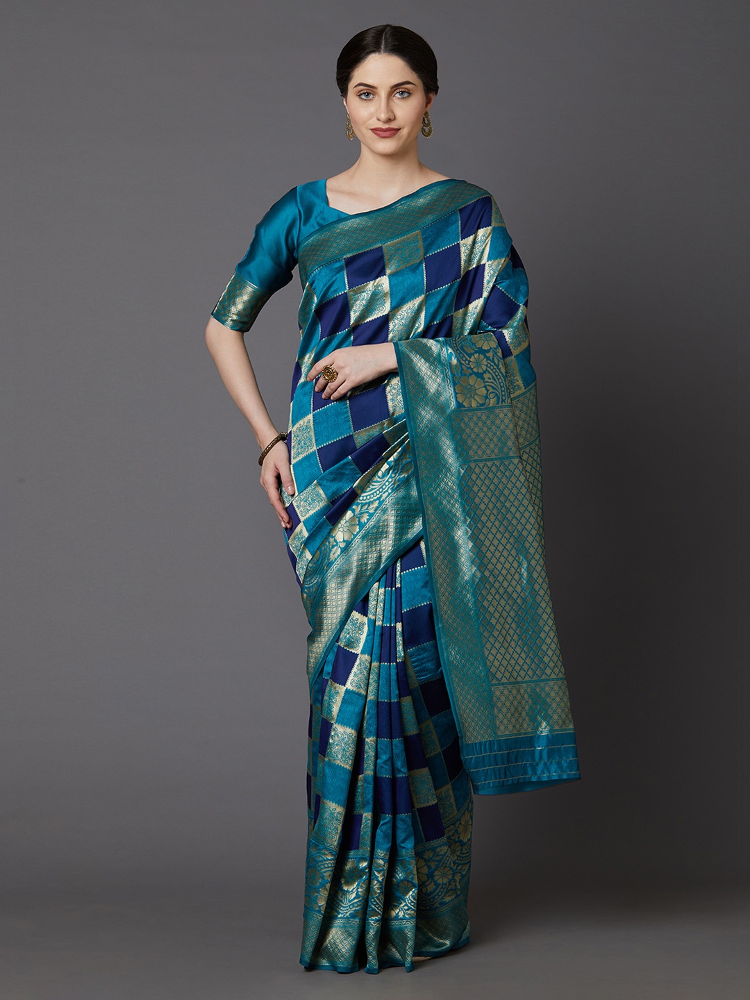 

Mitera Teal Blue & Golden Silk Blend Checked Banarasi Saree