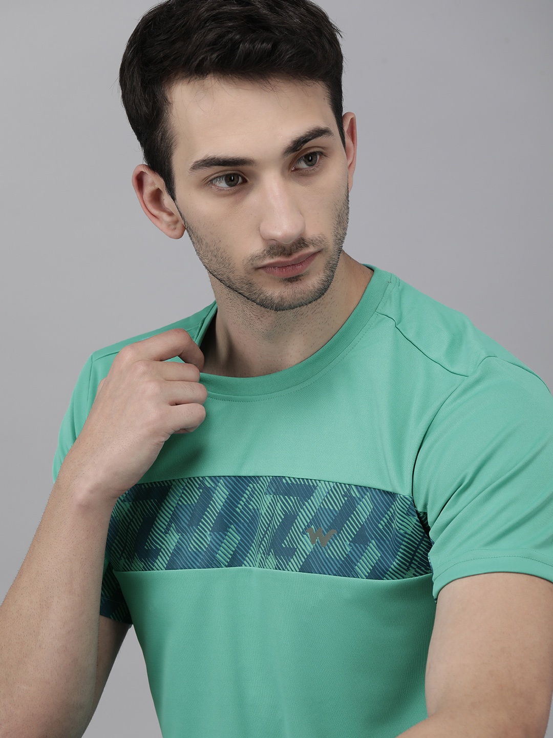 

Wildcraft Men Blue & Navy Blue Solid T-shirt with Stripes Surface