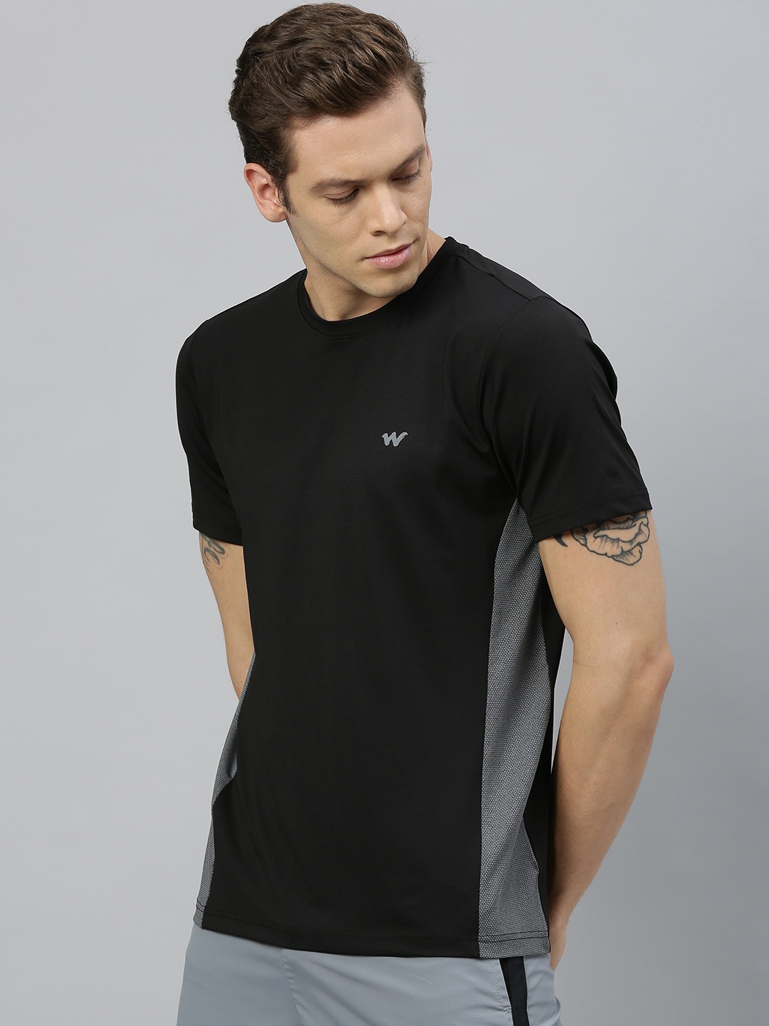 

Wildcraft Men Black Solid Round Neck T-shirt With Striped Detailing