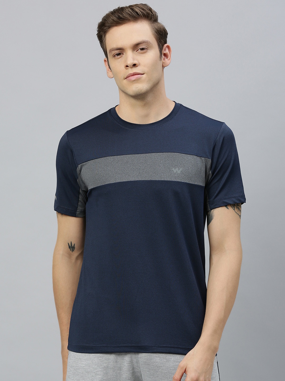 

Wildcraft Men Navy Blue Solid Round Neck T-shirt With Striped Detailing