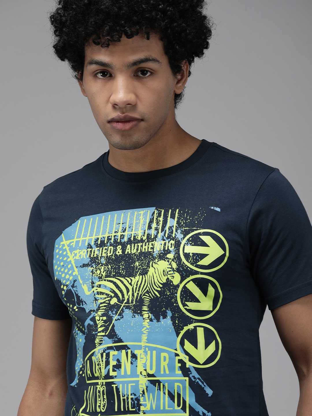 

Wildcraft Men Navy Blue Graphic Print Brand Logo Slim Fit T-shirt