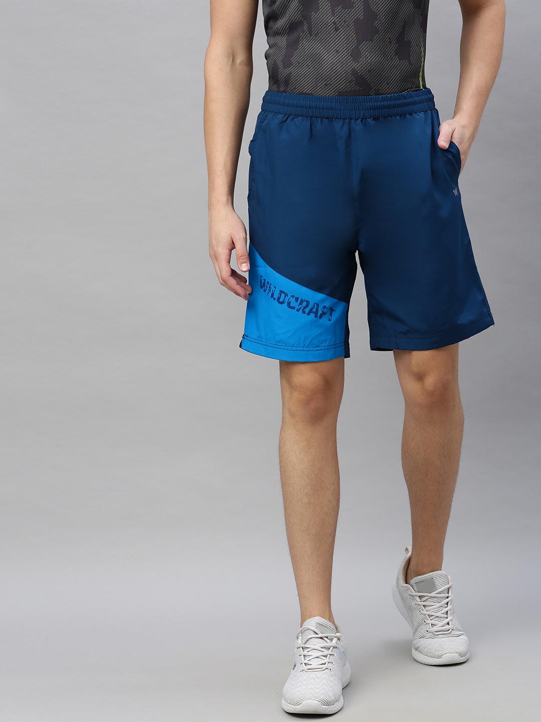 

Wildcraft Men Teal Colourblocked Regular Fit Regular Shorts