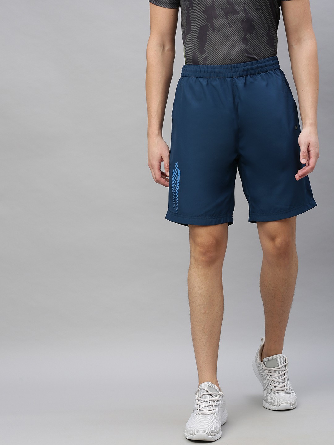 

Wildcraft Men Teal Solid Regular Fit Regular Shorts