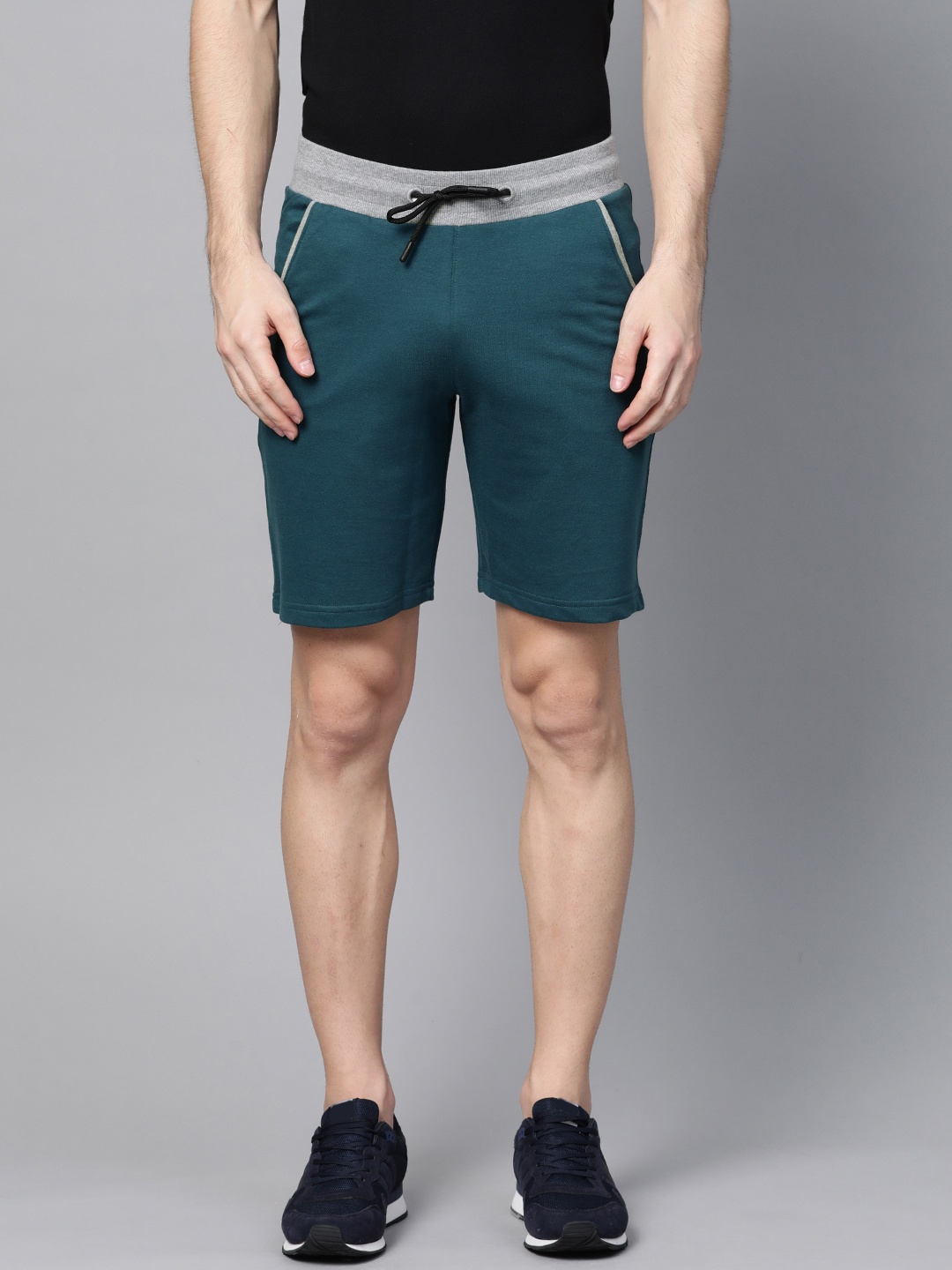 

ManQ CASUAL Men Teal Blue Solid Slim Fit Sports Shorts