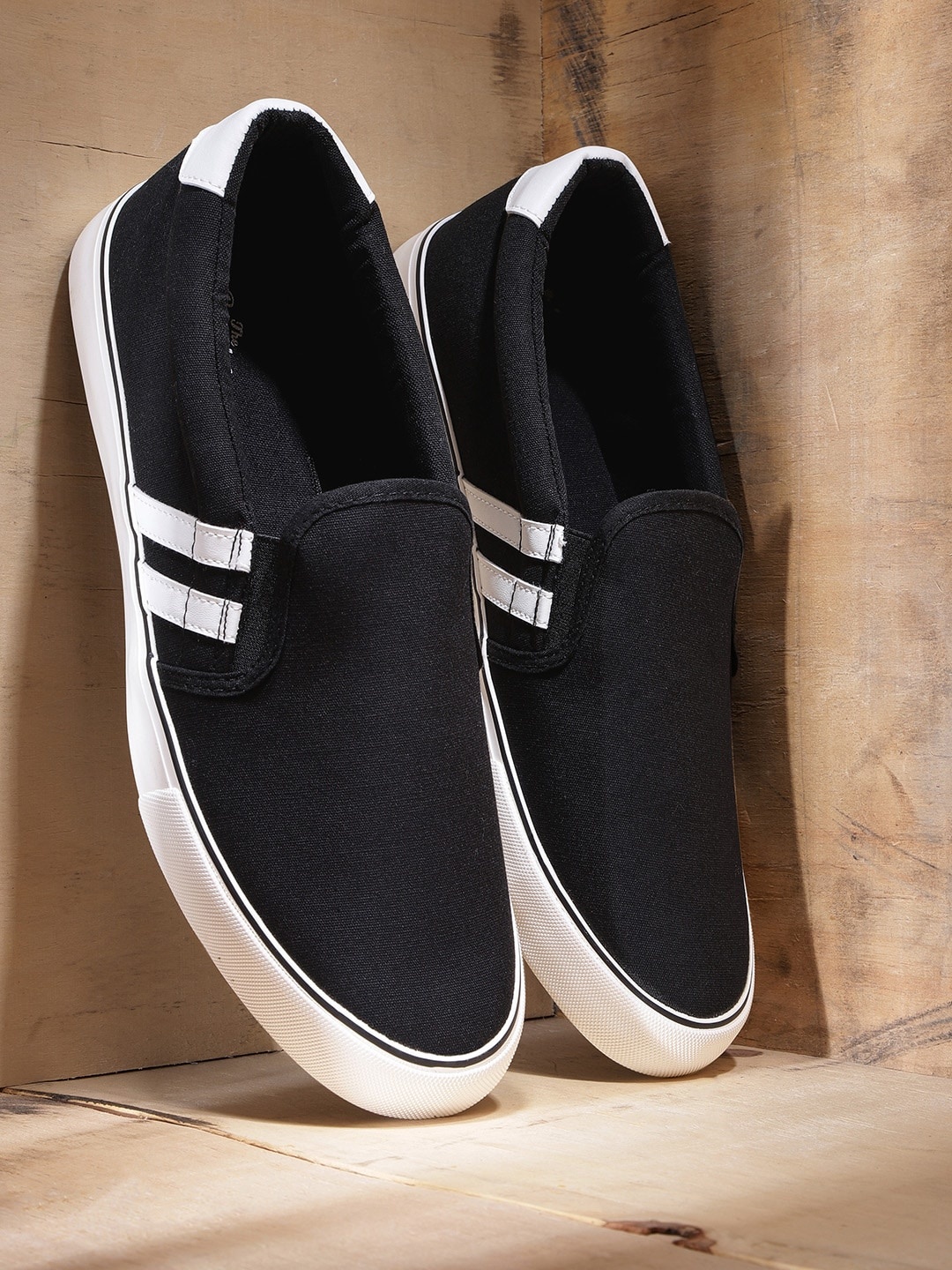 

Roadster Men Black Slip-On Sneakers