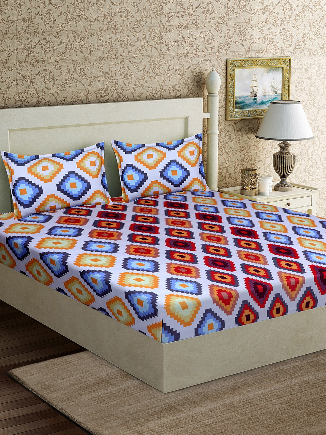 

Good Homes by Home Candy Blue & Orange Geometric 152 TC Polyester 1 Queen Bedsheet with 2 Pillow Covers