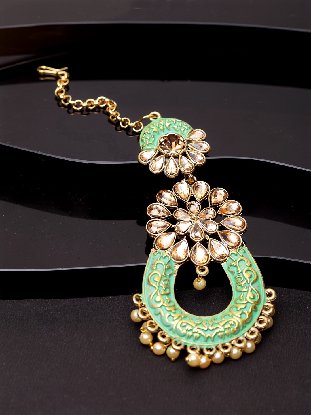 

ANIKAS CREATION Gold-Plated & Green Stone Studded Enameled Hand Painted Maang Tikka