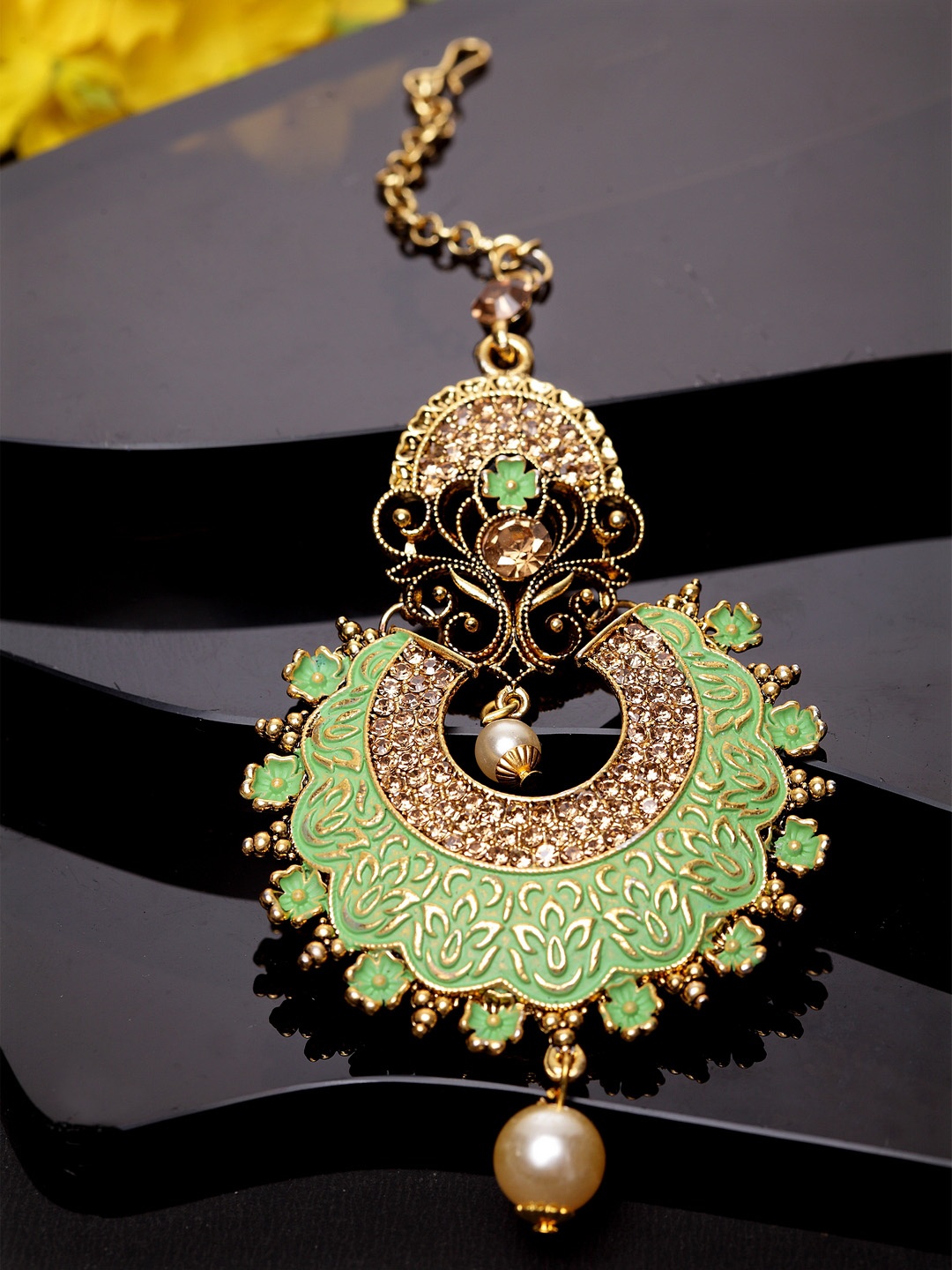 

ANIKAS CREATION Gold-Plated & Green Stone Studded Enameled Hand Painted Traditional Maang Tikka