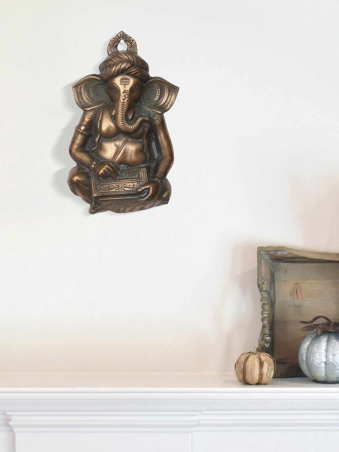 

eCraftIndia Bronze-Toned Lord Ganesha Playing Harmonium Wall Hanging