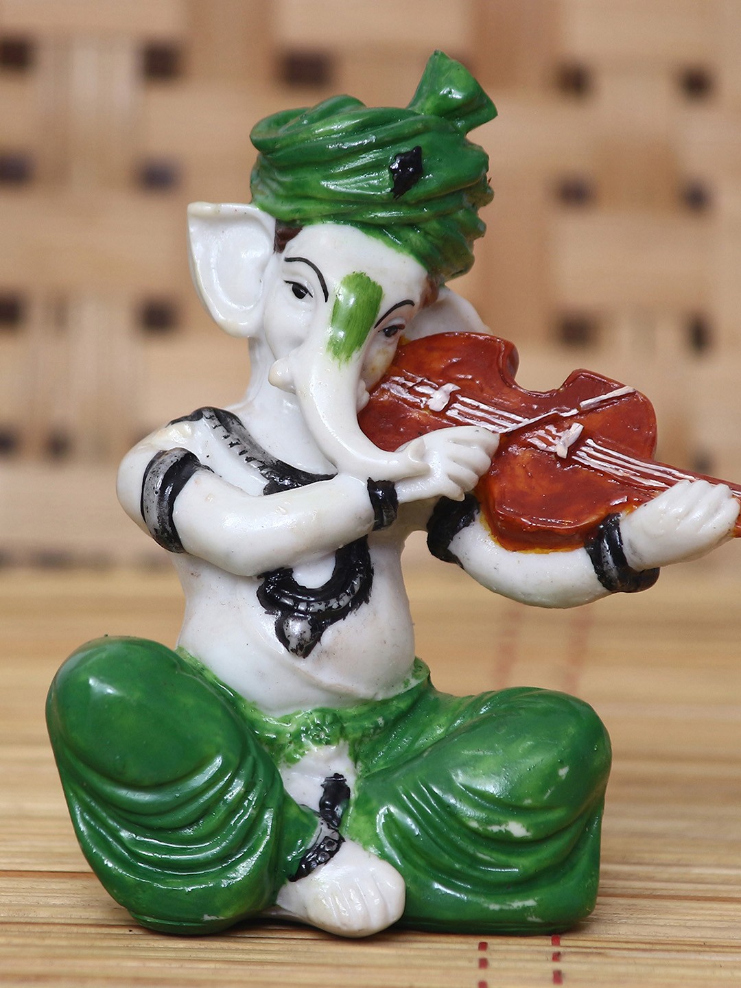 

eCraftIndia White & Green Handcrafted Lord Ganesha Playing Violin Idol