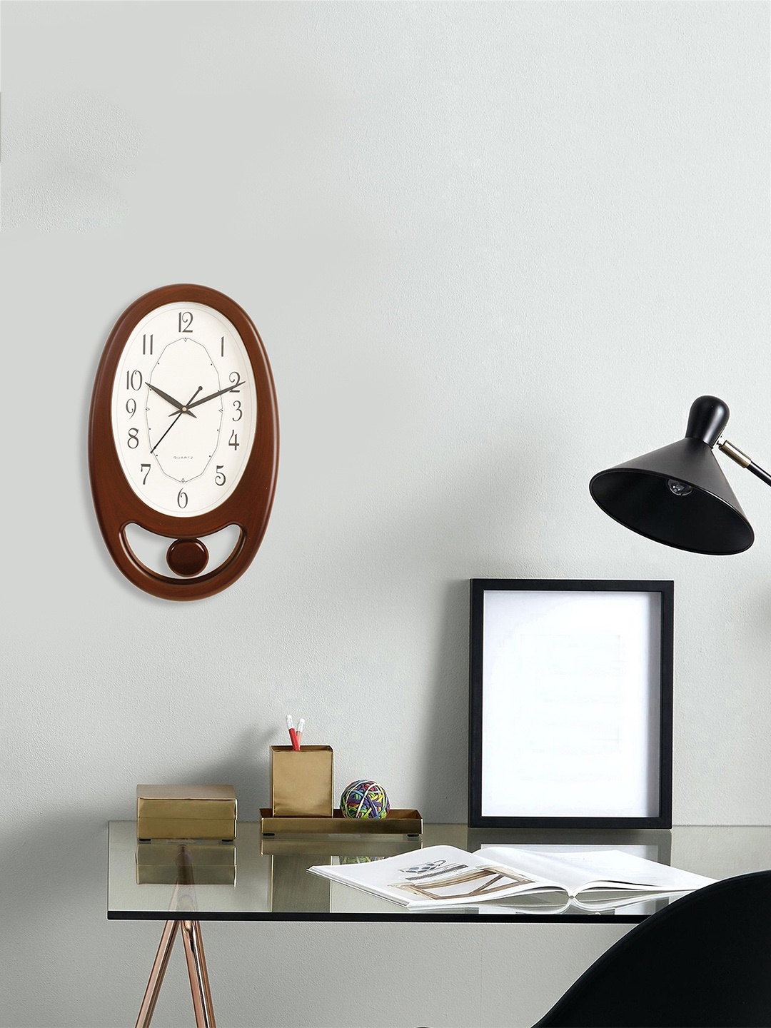 

eCraftIndia White & Brown Oval Solid Analogue Wall Clock