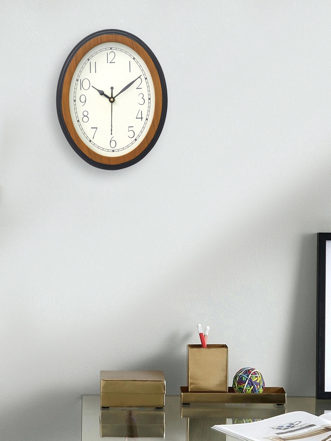 

eCraftIndia Brown & Cream-Coloured Oval 24 cm Solid Analogue Wall Clock