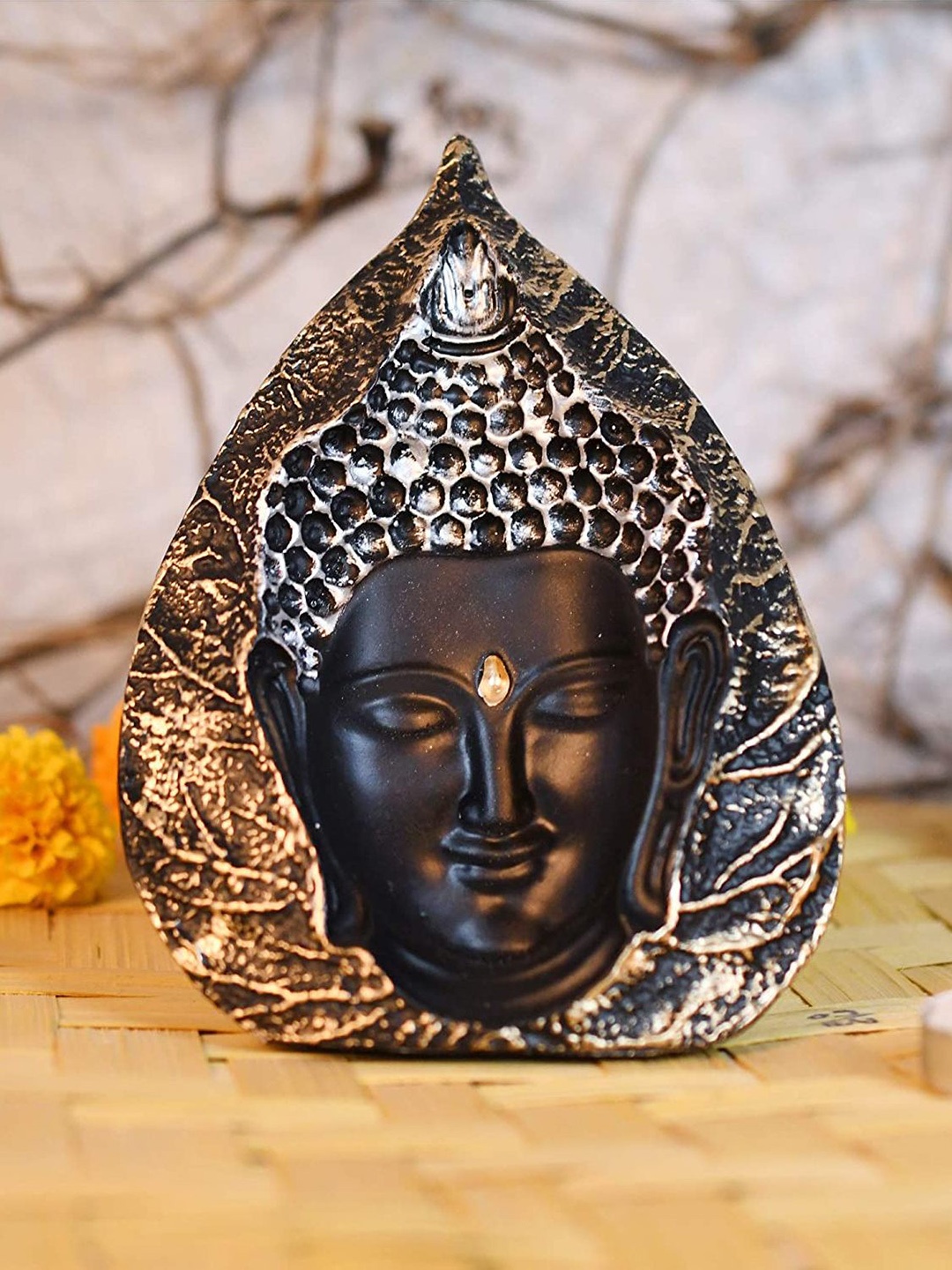 

CraftVatika Black & Gold-Toned 3D Buddha Face Sculpture In Leaf Shape Showpiece