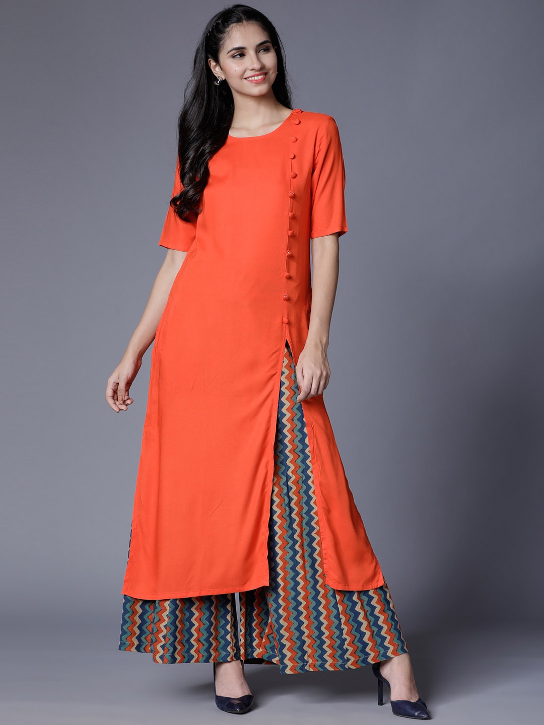 

Vishudh Women Orange Solid Straight Kurta