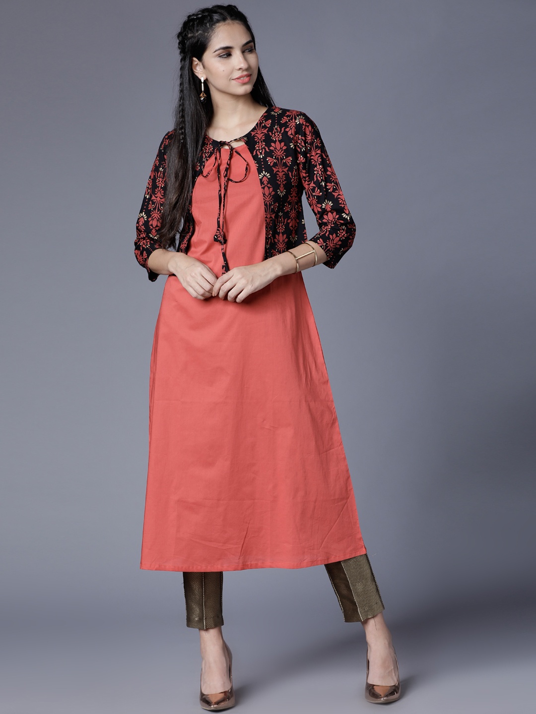 

Vishudh Women Orange & Black Solid Straight Kurta