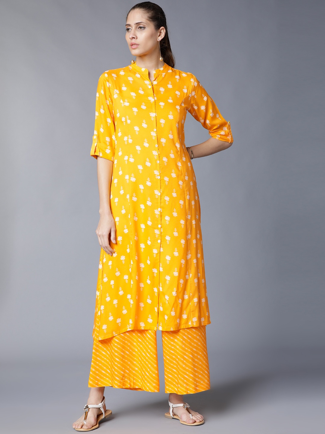 

Vishudh Women Yellow Printed Kurta with Palazzos