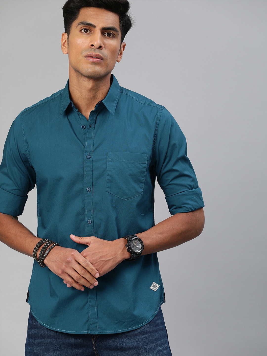 

Roadster Men Teal Blue Regular Fit Solid Sustainable Casual Shirt
