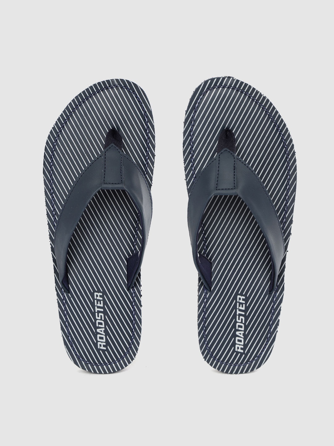 

Roadster Men Navy Blue & Grey Striped Thong Flip-Flops