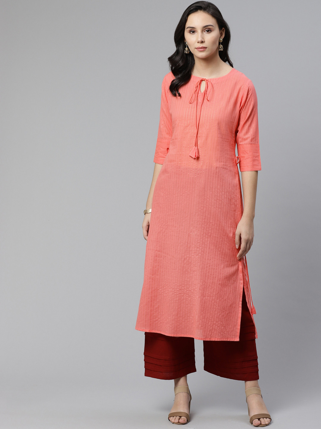 

Libas Women Coral Pink & Golden Self Striped Straight Kurta