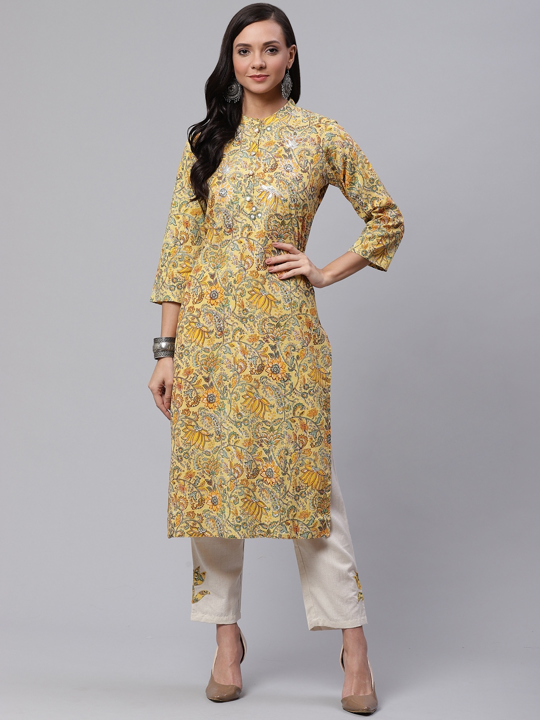 

Divena Women Yellow & Off-White Floral Printed Kurta with Trousers