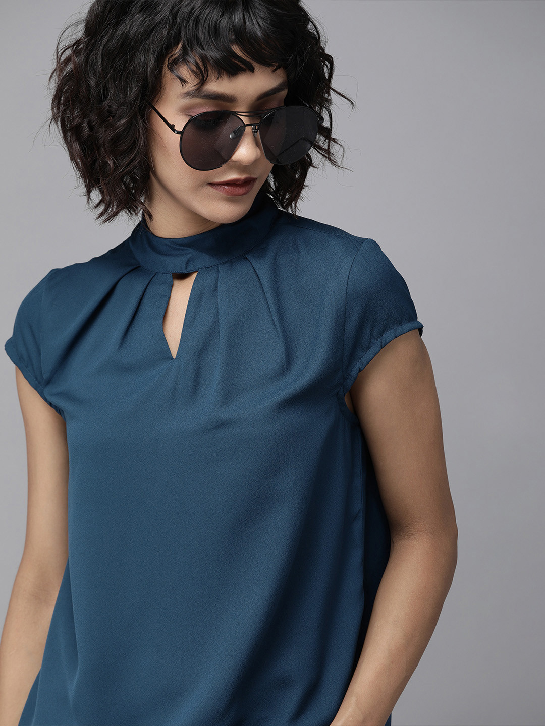 

Roadster Women Teal Blue Solid Key-Hole Neck A-Line Top with Pleats