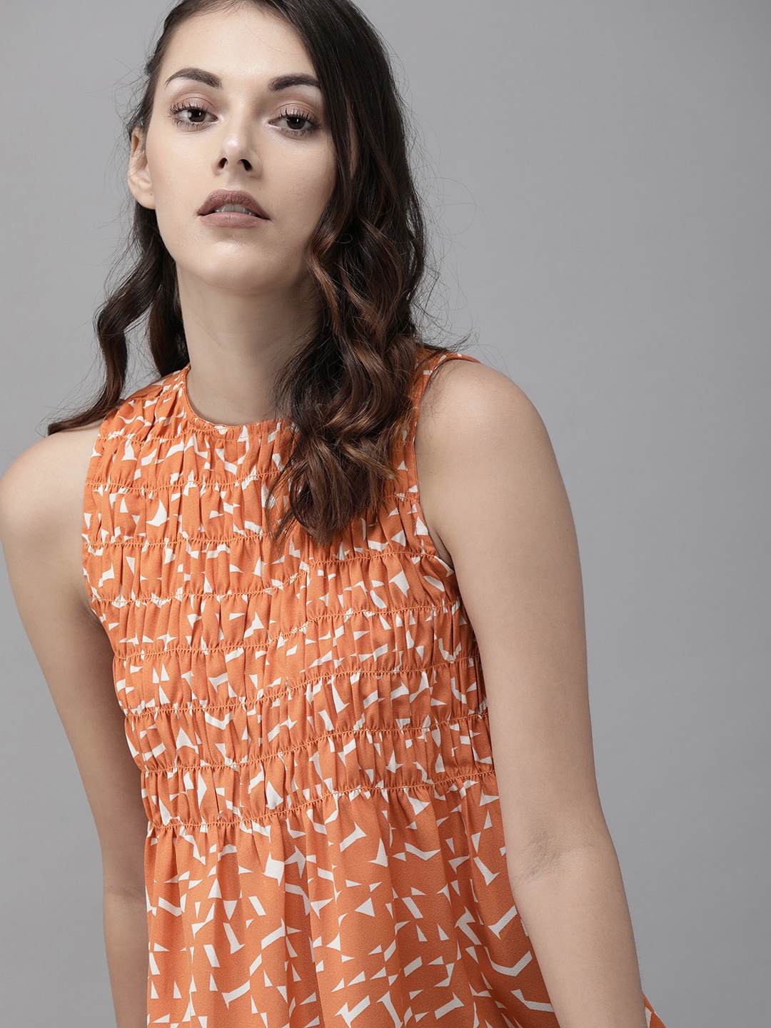 

Roadster Women Orange Printed Top with Smoked Details