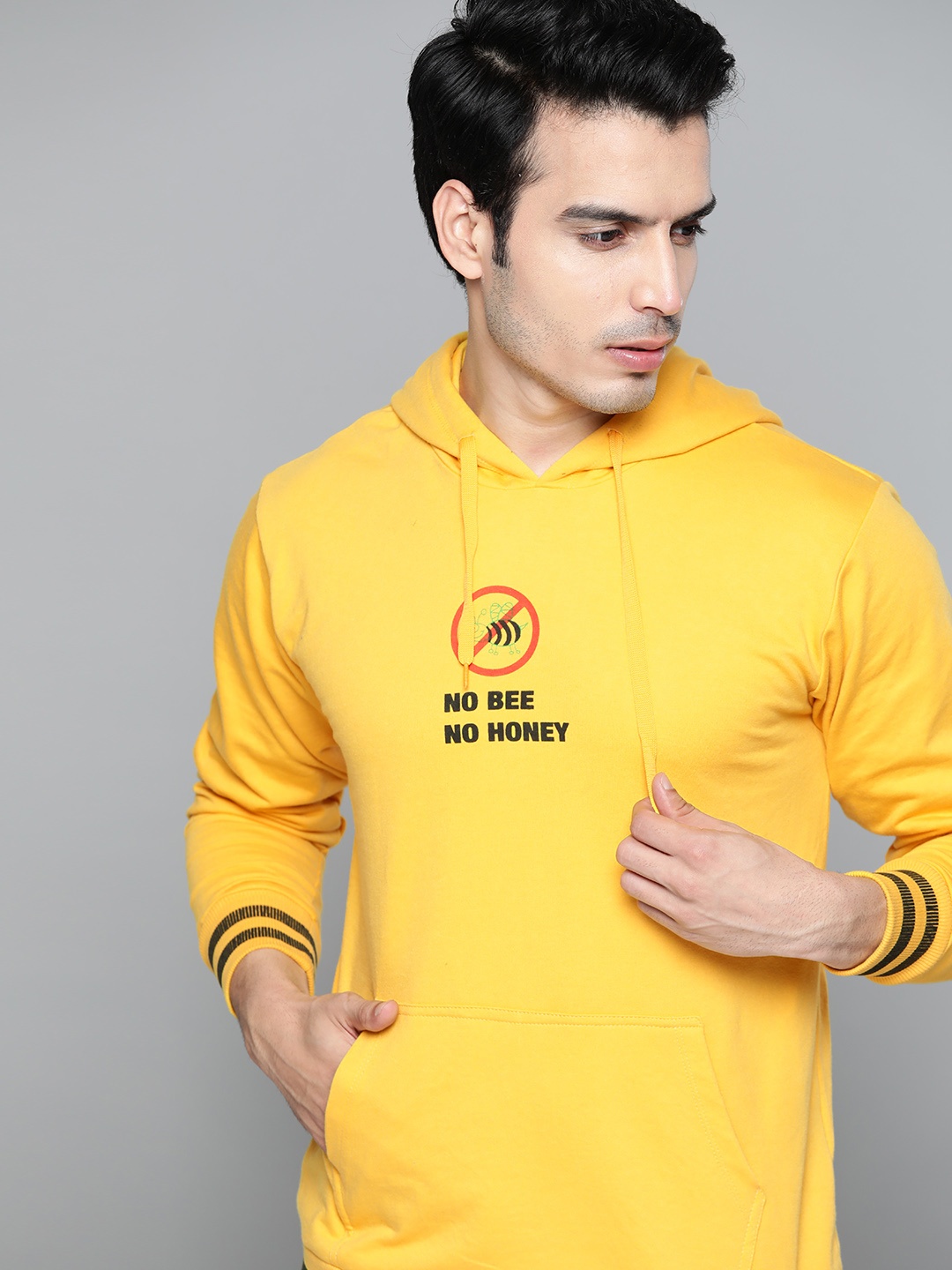 

Kook N Keech Men Yellow & Black Printed Hooded Sweatshirt