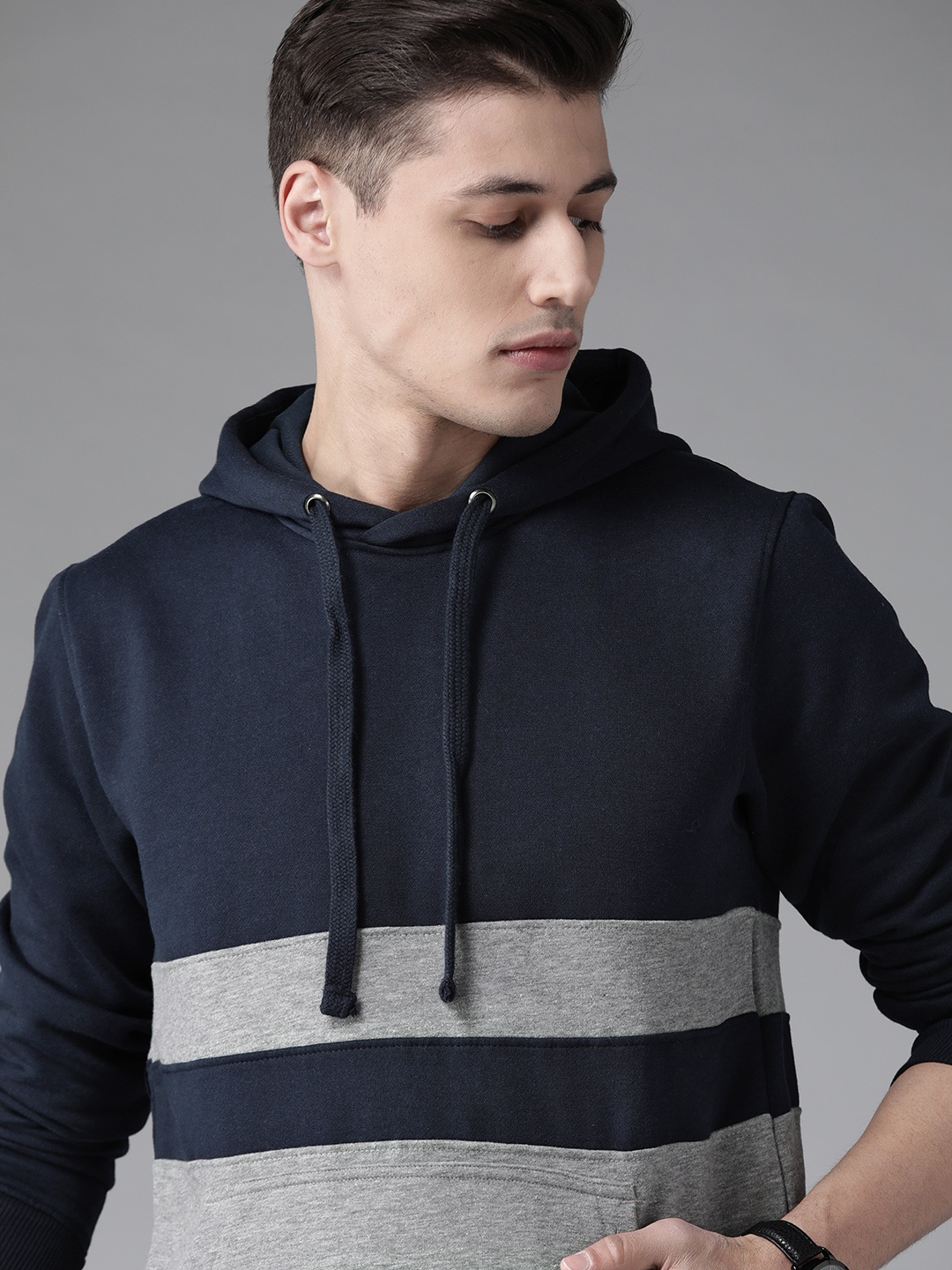 

Roadster Men Navy Blue & Grey Melange Colourblocked Hooded Sweatshirt