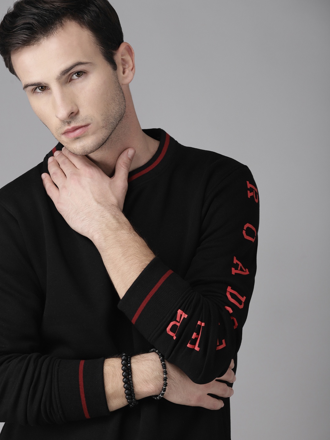 

Roadster Men Black Solid Sweatshirt