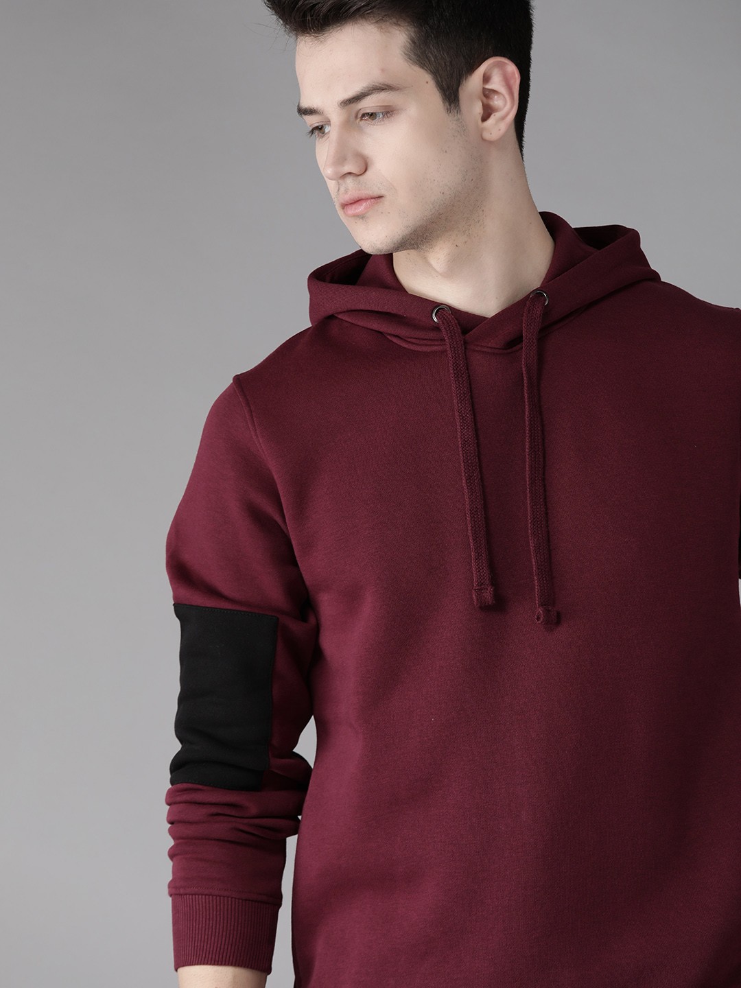 

Roadster Men Burgundy Solid Hooded Sweatshirt