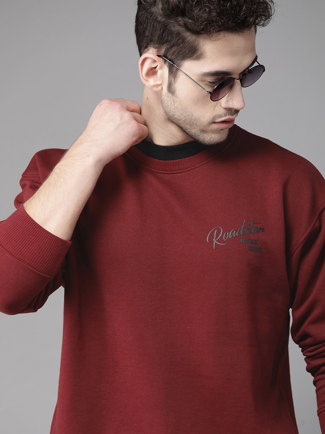 

Roadster Men Maroon Solid Sweatshirt