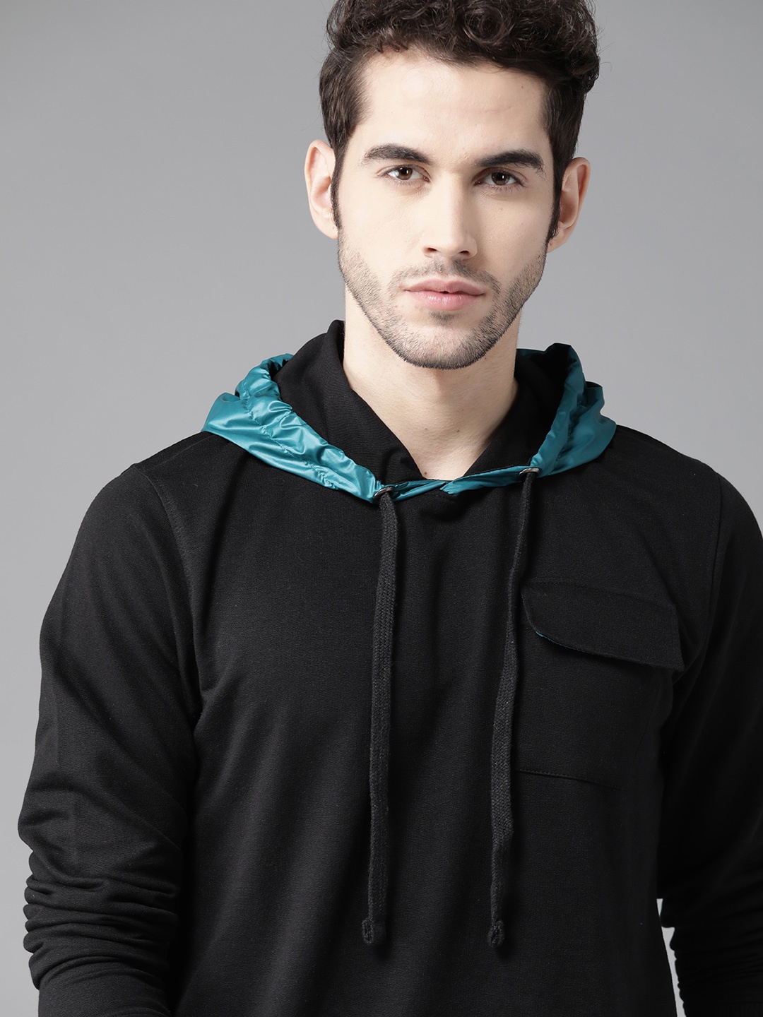 

Roadster Men Black Solid Hooded Sweatshirt