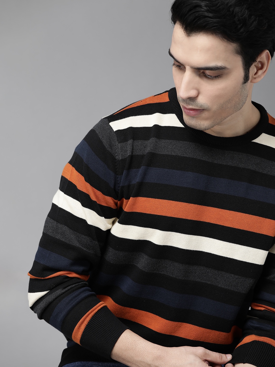 

Roadster Men Black & Orange Striped Pullover Sweater