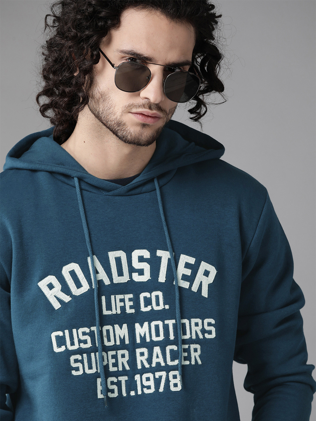 

Roadster Men Teal Blue & White Brand Logo Self Design Hooded Sweatshirt