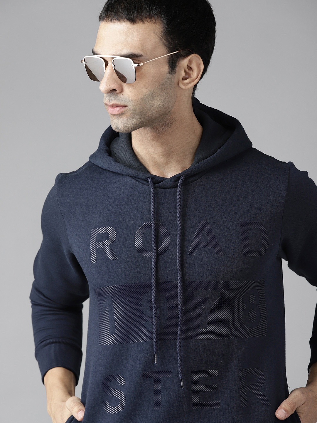 

Roadster Men Navy Blue Brand Logo Print Hooded Sweatshirt