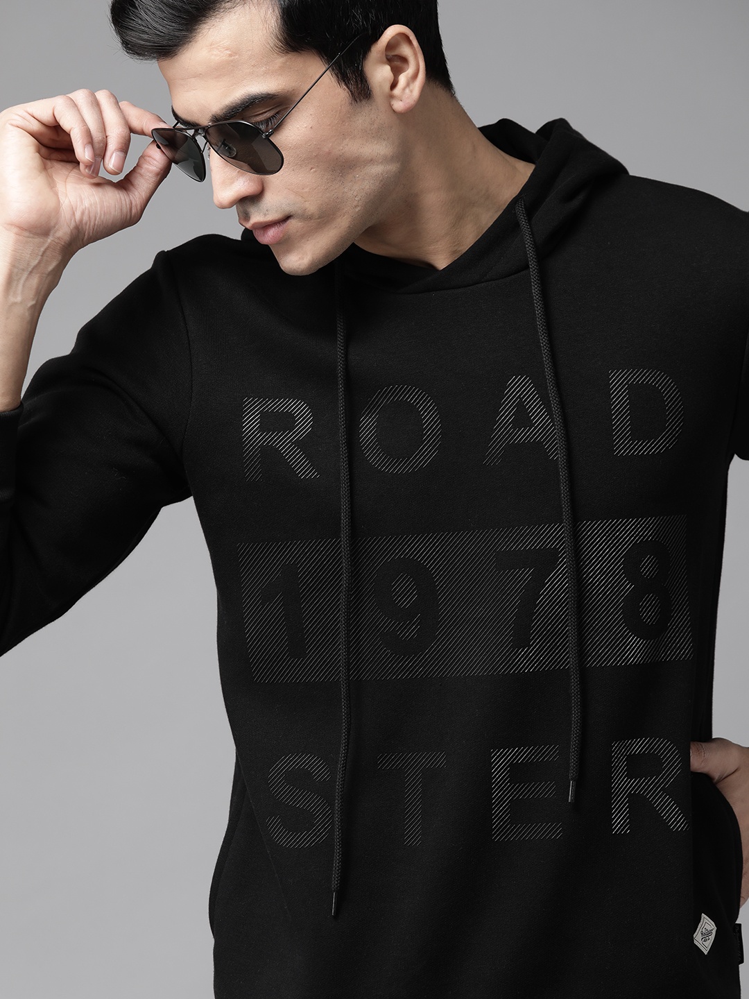 

Roadster Men Black Printed Hooded Sweatshirt