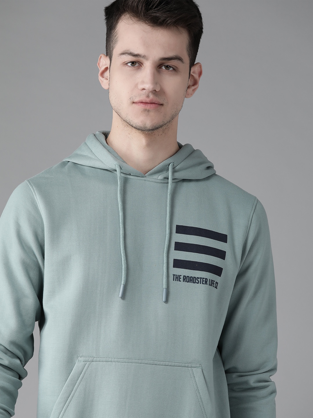 

Roadster Men Mint Green Solid Hooded Sweatshirt