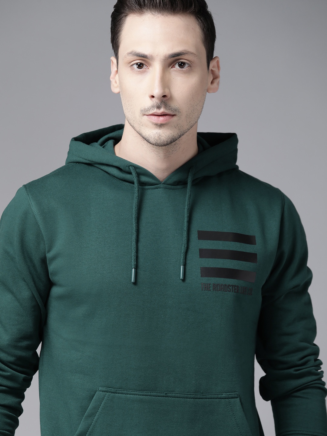 

Roadster Men Green Solid Hooded Sweatshirt