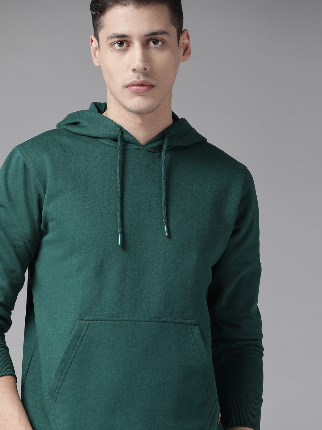 

Roadster Men Green Solid Hooded Sweatshirt